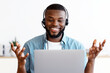 © Prostock-studio - Video Call. Cheerful African American Man In Headset Having Online Meeting With Laptop At Home, Smiling Black Freelancer Guy Making Web Conference On Computer, Enjoying Online Communication