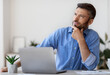 © Prostock-studio - Portrait Of Pensive Millennial Businessman Thinking About Busines Project At Workplace, Handsome Young Entrepreneur Sitting At Desk With Thoughtful Face Expression, Daydreaming, Closeup Shot