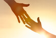 © kieferpix - People helping each other giving a helping hand on sky sunset background, Family support, trust together,