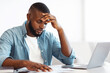 © Prostock-studio - Work Troubles. Frustrated African American Businessman Reading Documents In Office, Sitting At Desk And Checking Financial Reports, Exhausted Black Millennial Man Feeling Sick And Tired, Free Space