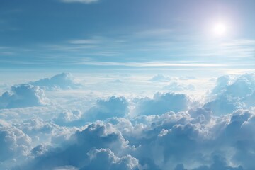 Wall Mural - aerial view of fluffy white clouds with glimmering sun above a blue sky horizon