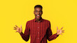 © Prostock-studio - Portrait Of Overjoyed African American Guy Raising Hands In Excitement, Amazed Black Millennial Man Emotionally Reacting To Good News Or Offer, Standing Isolated Over Yellow Background, Copy Space