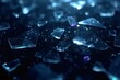 © JuliusGideon - Scattered Blue Glass Shards on Dark Reflective Base