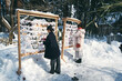 © Hideo Tsuto field - 神社でおみくじを結ぶ日本人女性