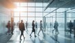 © Raisa - Blurred motion of people walking in modern office space with glass walls. Business workplace. Rush hour. Team of colleagues in financial district with copy space. Bright sunny day.