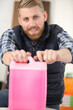 © auremar - young man holding jerrycan