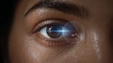 Laser Eye Vision Correction Procedure With A Colored Dark-Skinned Lady's Eye and Laser Beam Close View Background