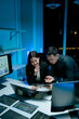 © Daenin - Team of coworkers working at night to develop or plan discussions, suggestions or ideas with business men and women working as a team in the evening.