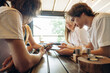 © standret - Addicted to smartphones. Group of young friends are in the cafe restaurant