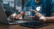 © Jahanara - Person interacting with etf finance and investment icons using digital devices