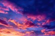 © Reza Design - Stunning Vibrant Sunset Fiery Orange and Pink Clouds Against Deep Blue Sky