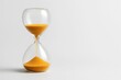 © CreativeLight - Classic hourglass with golden sand symbolizing passing time patience deadlines and limited resources concept