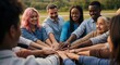 © Awan - Diverse group of people stacking hands showing unity and cooperation achievement vision success with happy faces