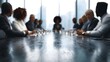 © Bussakon - Professionals gathered around a boardroom table for a meeting