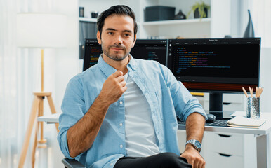 profile's smart it developer looking camera to pose against on software development coding on two pc