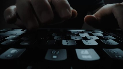 Wall Mural - close-up man typing on computer keyboard with hands and fingers. macro soft focus dolly shot. comput