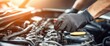 © Underhood - An auto engine is being repaired by a skilled car mechanic and technician in this close-up view