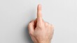 © Ohana - A hand raised with a single finger pointed upwards against a neutral background, symbolizing focus or a call to attention.