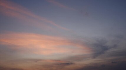 Wall Mural - a captivating sunrise sky timelapse with soft pink and purple clouds glowing gently against a fading