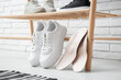 © Pixel-Shot - Sneakers with orthopedic insoles in hallway, closeup