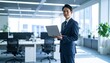 © 순단 강 - A Korean man in a suit holding a laptop computer to the right, with luxury office furniture in the blurred background