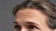 © Marut - Close up of mature woman forehead with visible wrinkles and natural skin texture showing aging signs and expression lines