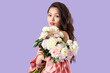 © Pixel-Shot - Young Asian woman in robe with peony flowers on lilac background