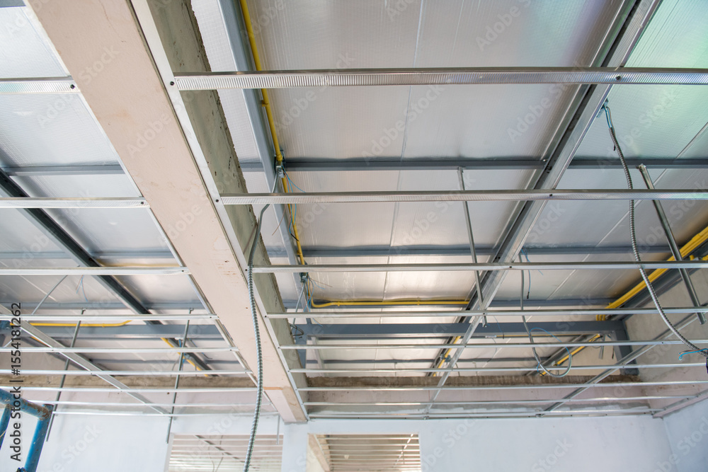 Interior renovation project showing new ceiling installation. An