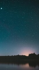 Wall Mural - Lyepyel District, Vitebsk Province, Belarus. Real Colorful Night Stars Above Lepel Lake. Natural Starry Sky Background Backdrop Landscape. Time lapse.