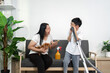 © itchaznong - Cleaning and Joyful Moments. A mother and son share laughter while cleaning, promoting teamwork at home.