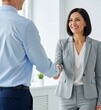 © picturehome - Happy professional mid aged business woman manager handshaking at office meeting. Smiling female hr hiring recruit at job interview, bank or insurance agent, lawyer making deal with client at work.