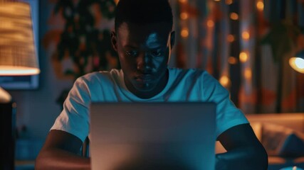 Wall Mural - a person seated at a desk with a laptop open