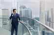 © ReeldealHD images - Businessman in Suit Looking Out Over City Skyline