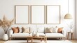 © Imam - Modern living room with white sofa, beige pillows, and three empty vertical frames on a white wall. Stylish, minimalist, perfect for wall art mockup and home decor design.