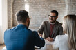 © Novak - Business people meeting with a banker