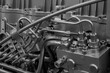 © Aleksandr Matveev - Close up of a large engine with many pipes and valves. Concept of complexity and intricacy, as the various components work together to power the engine.