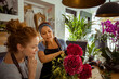 © Davor - Mother and daughter florists working with flower arrangement in a shop