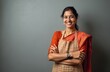 © Vadym - Smiling Indian woman wearing apron looks camera. Happy female chef cook, arms crossed. Portrait of Indian housewife wearing red saree. Cooking, home, food, people, restaurant, cafe, hospitality.