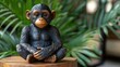 © Irma - Adorable baby chimpanzee figurine sitting on wooden base.