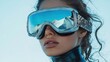 © YuliaLyubimova - A stylish woman in futuristic ski goggles reflects snowy mountains, wrapped in a luxurious fur coat