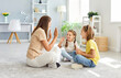 © Studio Romantic - Mother playing with children at home, engaging in active games. The family enjoys a fun and happy leisure time, sharing laughter and excitement as they bond through these joyful moments.