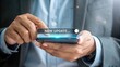 © Grafix71 - Person s hands holding smartphone displaying new update notification with glowing effect mobile