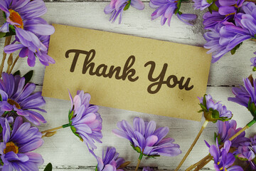  Thank You text with flowers decoration on wooden background