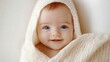 © Yaroslav Herhalo - Soft and innocent newborn baby wrapped in a cozy white blanket, captured in a serene portrait with gentle natural light.