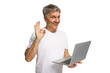 © muse studio - Smiling man in casual attire shows positive gesture while holding a laptop in a bright, transparent background