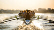 © arthub Tokyo - Crew team rowing swiftly across the water during golden hour creating splashes with their oars in a race.