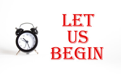 Wall Mural - let us begin symbol. concept word let us begin on beautiful white background with alarm clock. busin