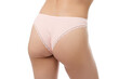 © New Africa - Woman wearing beautiful underwear on white background, closeup