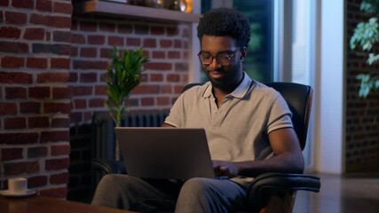 African American man businessman business employer typing laptop in night office overtime online studying deadline task in evening smiling guy male CEO manager programmer computer working web search