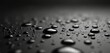 © Pete - Close-up image shows water drops on dark surface. Raindrops macro on non-wetting black background. Water-repellent layer, liquid surface. Abstract background suitable for design and tech promo.